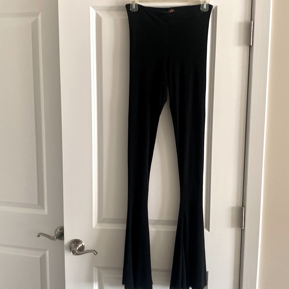 Jean Paul Gaultier black double stretch mesh bell bottoms. Size L